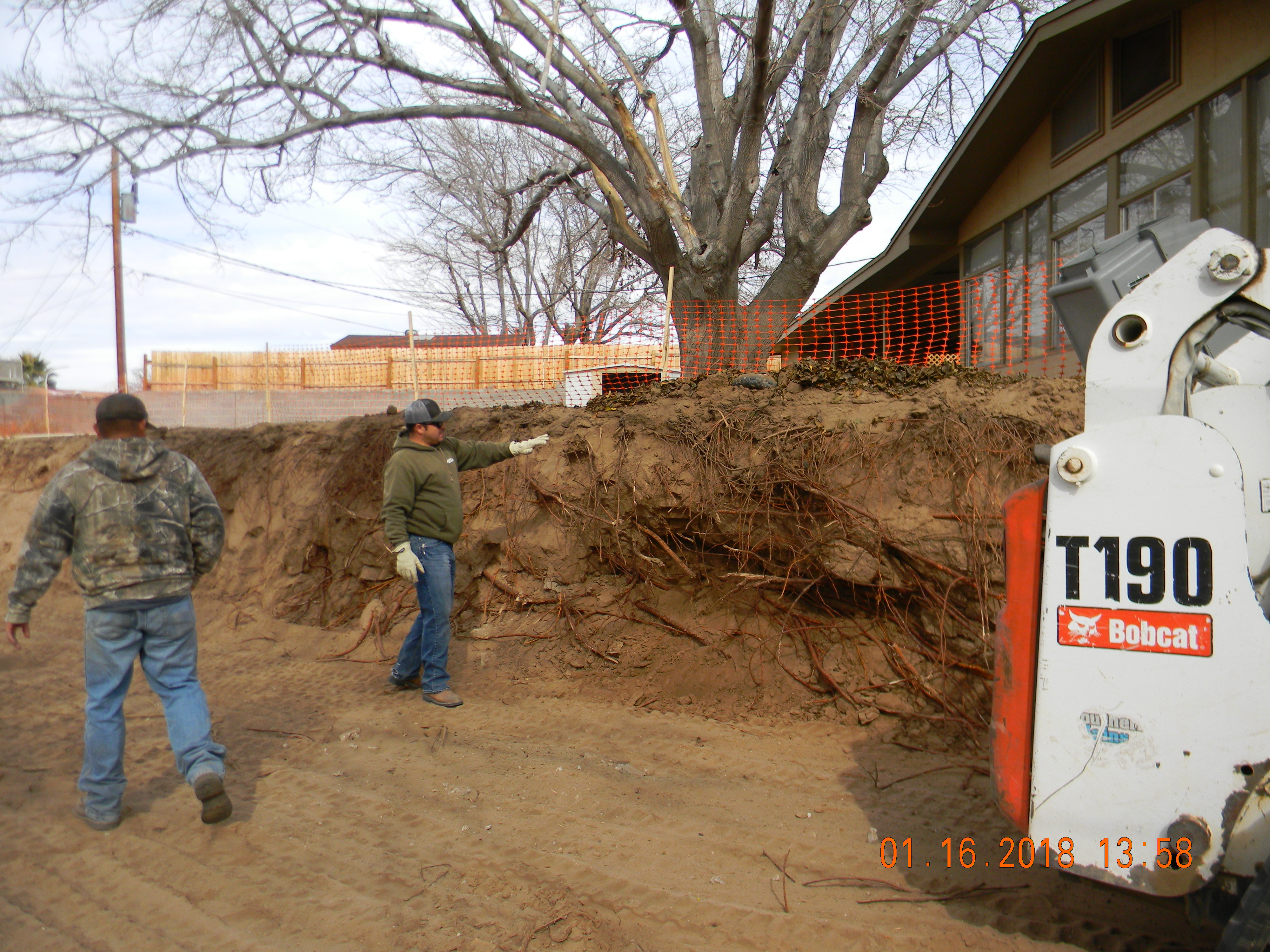 Demolition Men Working On Retaining Wall